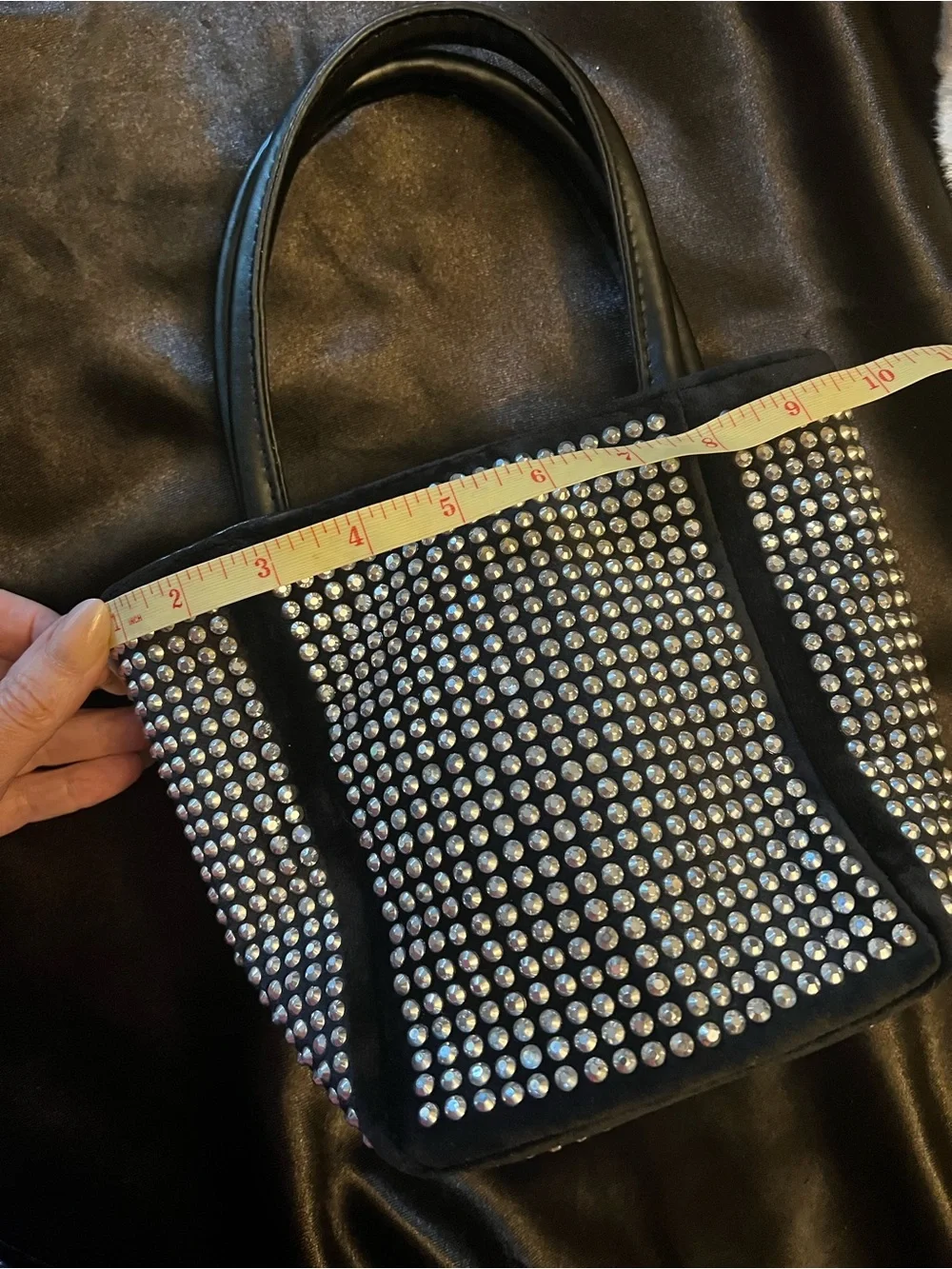 Fun and funky black and silver studded bucket bag. 80s and 90s studio 51 vibes!